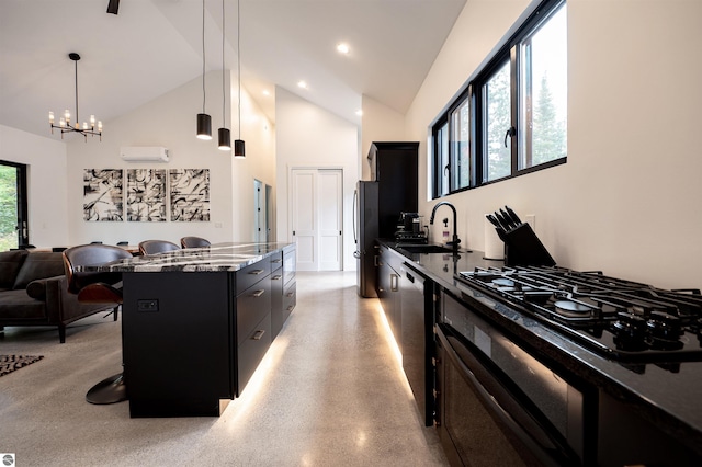 kitchen featuring a center island, a breakfast bar area, pendant lighting, and a wealth of natural light