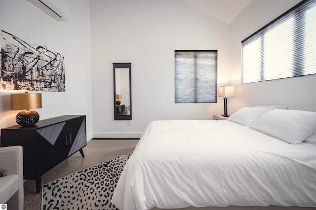 bedroom featuring carpet, vaulted ceiling, and an AC wall unit