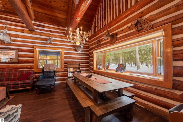 dining space with rustic walls, plenty of natural light, and dark wood-type flooring