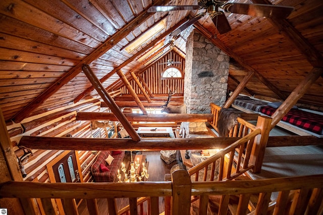 staircase featuring wooden ceiling and vaulted ceiling with beams