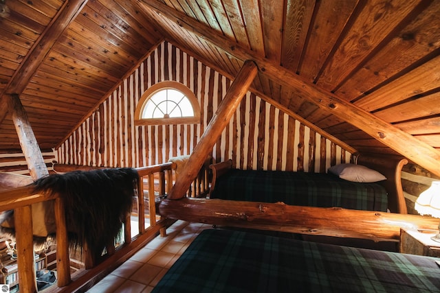 interior space featuring wood ceiling, light tile patterned flooring, and lofted ceiling