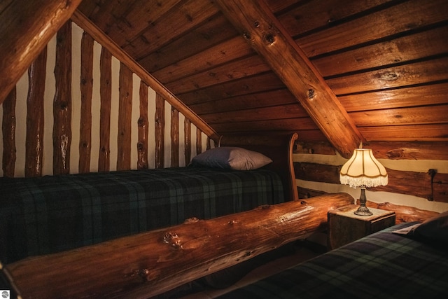 unfurnished bedroom featuring wood ceiling and lofted ceiling