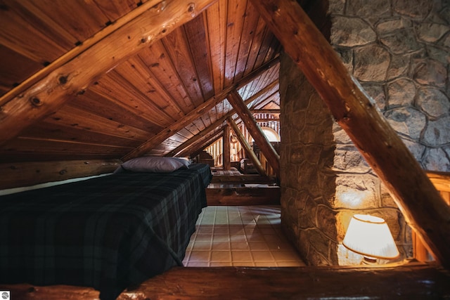 bedroom featuring wooden ceiling and tile patterned floors