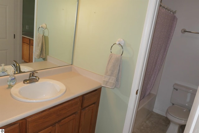 full bathroom with vanity, shower / bath combo with shower curtain, toilet, and tile patterned flooring