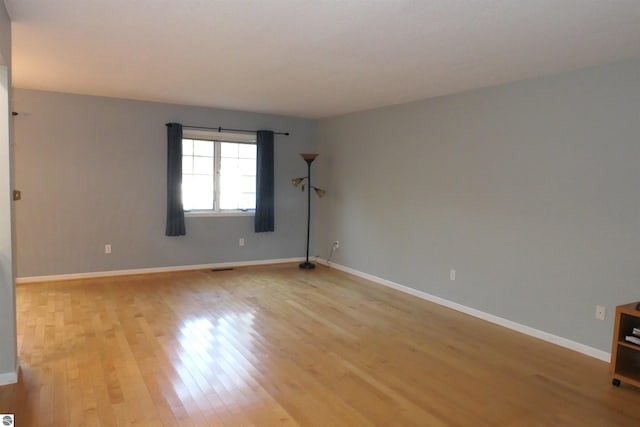 unfurnished room featuring light hardwood / wood-style flooring