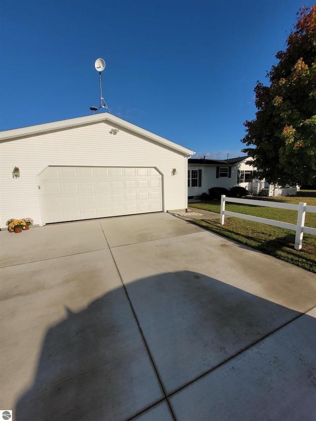 exterior space featuring a garage and a front yard