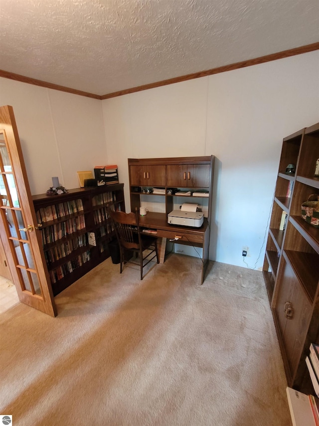 home office with a textured ceiling, crown molding, and light colored carpet