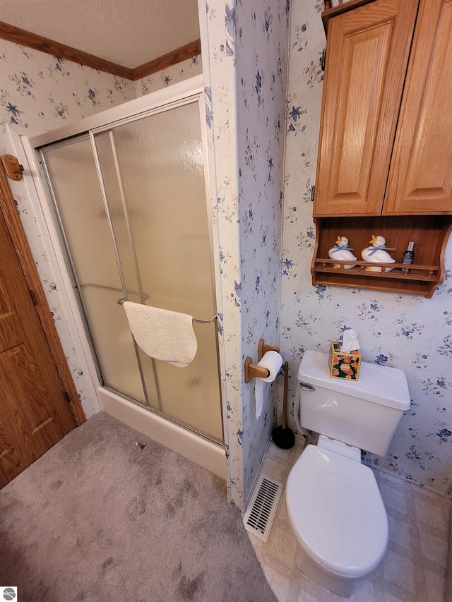 bathroom with crown molding, walk in shower, and toilet