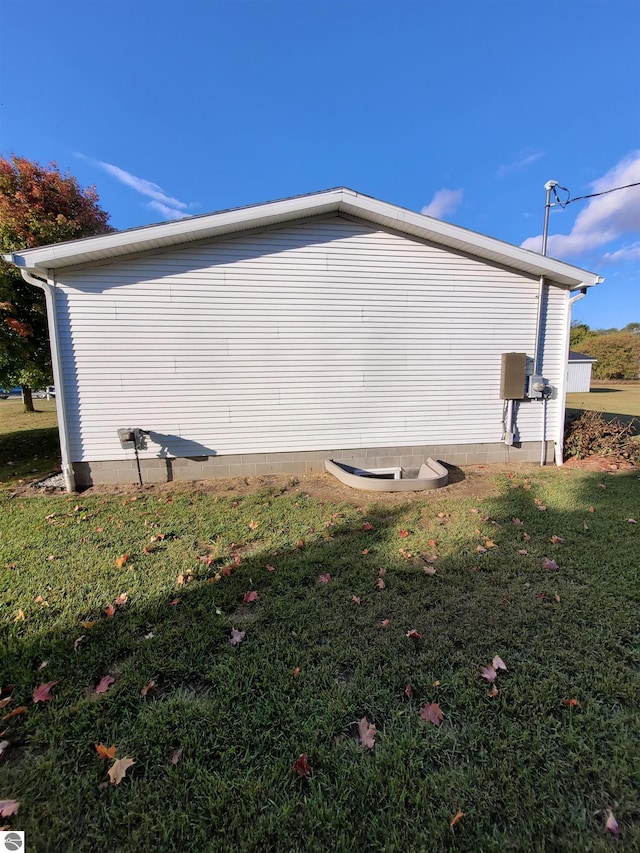 view of home's exterior with a lawn