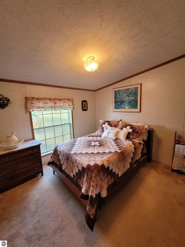 bedroom with a textured ceiling, carpet, and ornamental molding