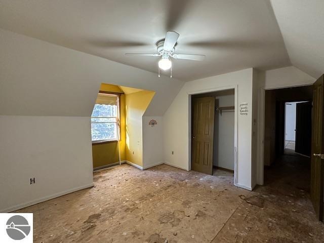 bonus room featuring ceiling fan and vaulted ceiling