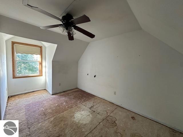 bonus room featuring lofted ceiling and ceiling fan