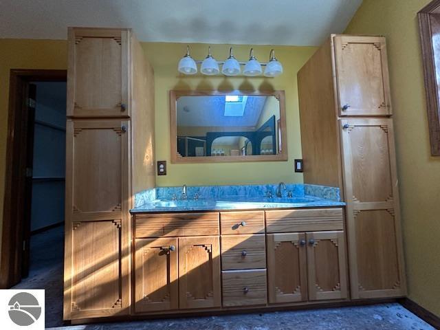 bathroom featuring dual sinks