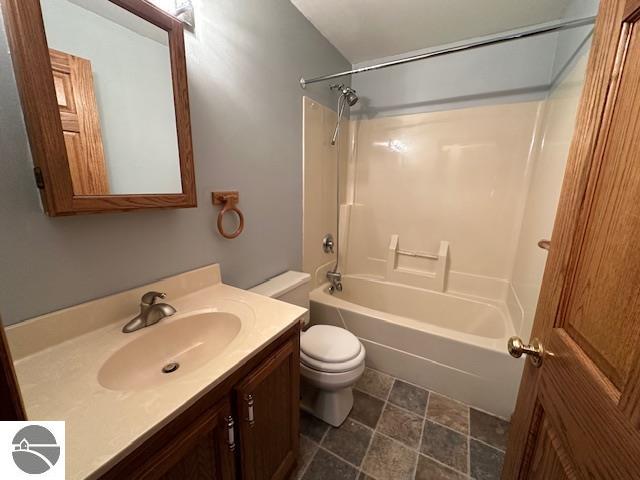 full bathroom featuring shower / tub combination, vanity, and toilet