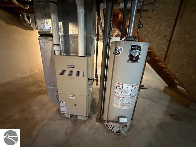 utility room with gas water heater