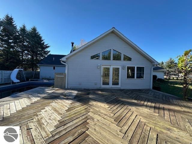 back of house featuring a deck