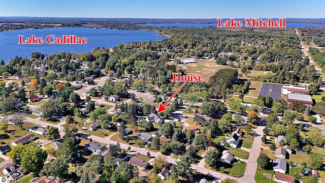 birds eye view of property with a water view