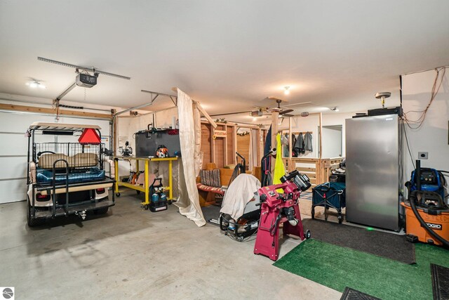 garage featuring a garage door opener and ceiling fan