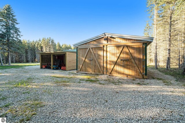 view of outbuilding with a carport