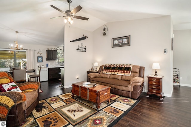 living room with ceiling fan with notable chandelier, lofted ceiling, and dark hardwood / wood-style flooring