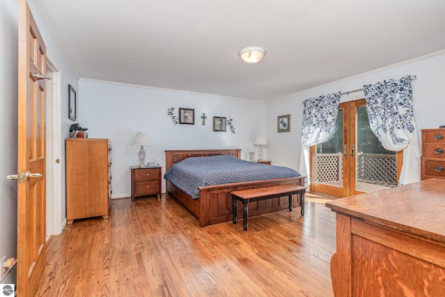 bedroom featuring crown molding, access to outside, and light hardwood / wood-style flooring