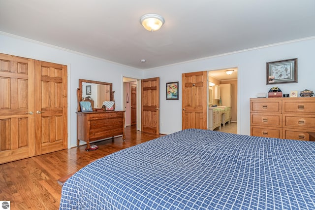 bedroom with crown molding and hardwood / wood-style floors