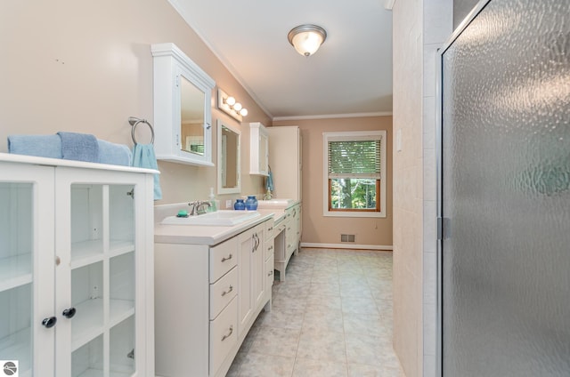 bathroom featuring walk in shower, ornamental molding, vanity, and tile patterned floors