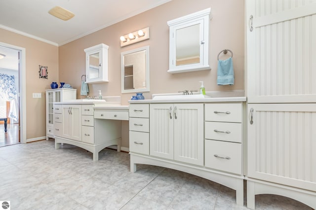 bathroom with vanity and ornamental molding