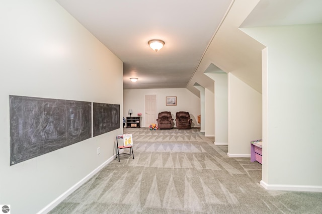 bonus room featuring light carpet