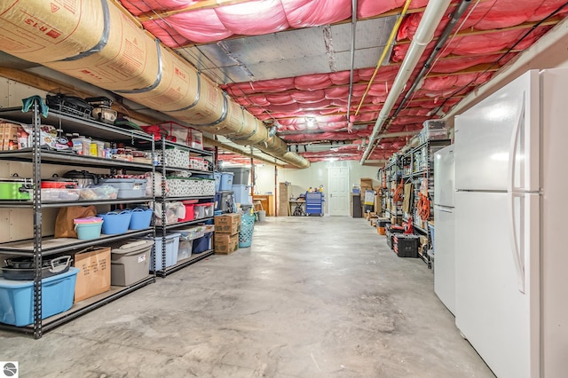 basement with white fridge