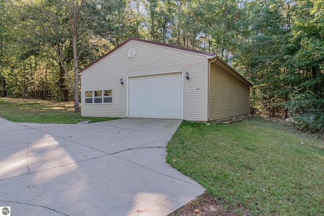 garage featuring a yard