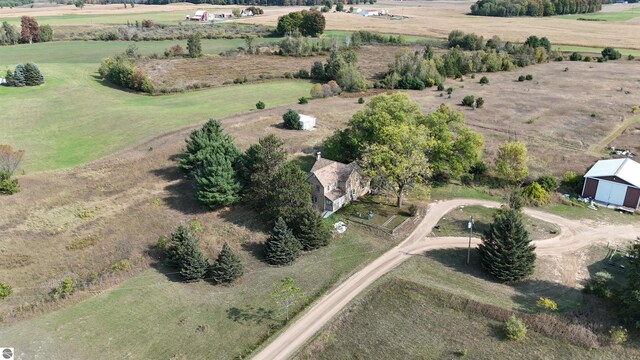 birds eye view of property with a rural view