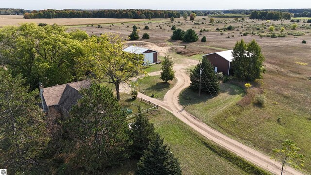 birds eye view of property with a rural view