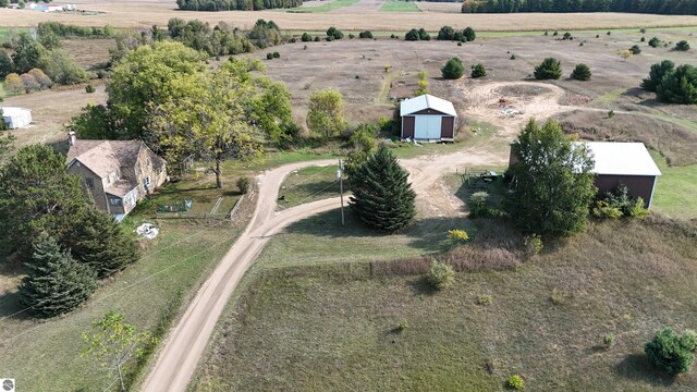 birds eye view of property featuring a rural view