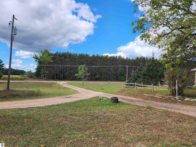 view of property's community with a yard