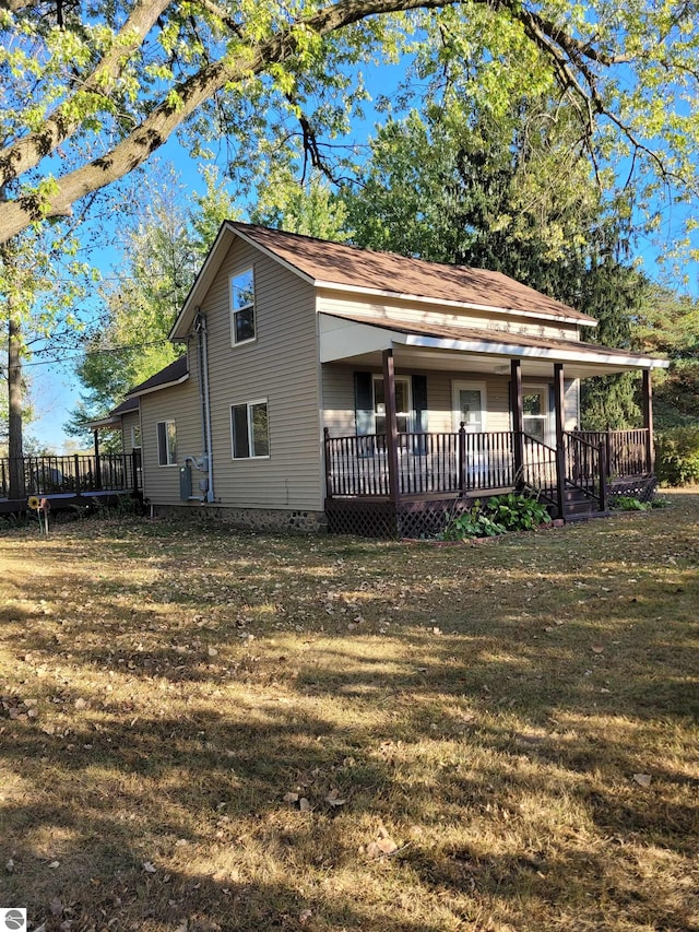 exterior space with a yard and a wooden deck