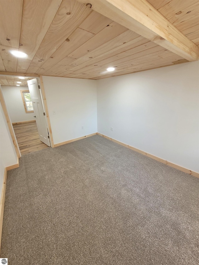 basement with carpet floors and wooden ceiling