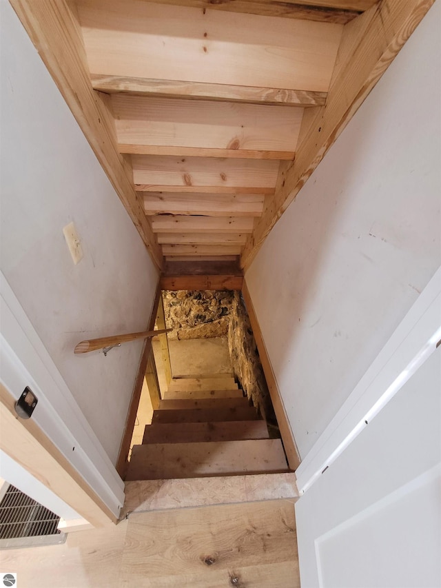 stairway with beam ceiling