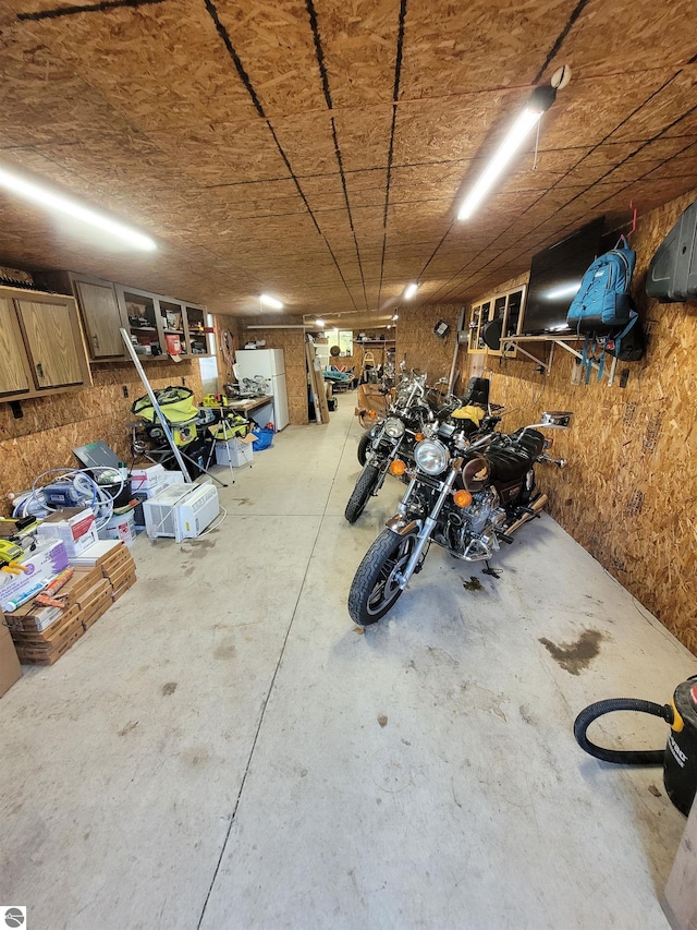 garage with white refrigerator