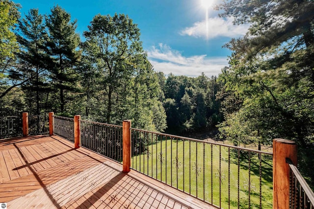 wooden deck with a yard