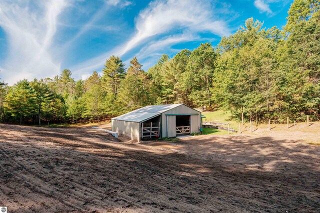 view of outdoor structure featuring a rural view