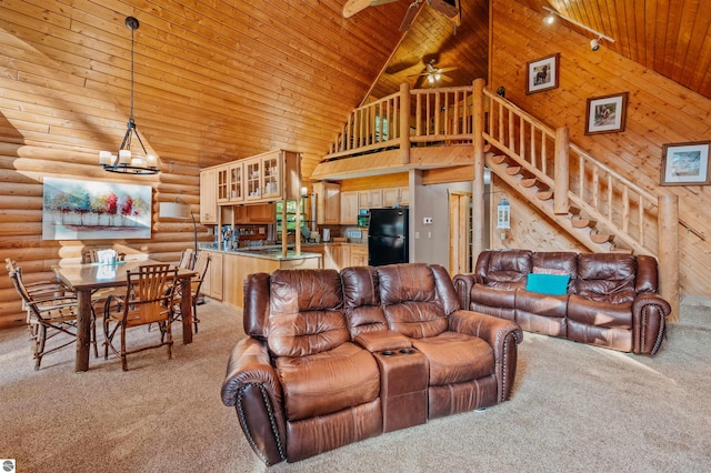 living room with wood ceiling, log walls, ceiling fan with notable chandelier, light colored carpet, and high vaulted ceiling