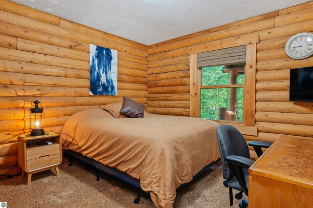 carpeted bedroom with a textured ceiling and rustic walls