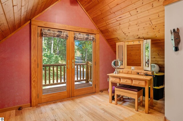 interior space featuring light wood-type flooring, wood ceiling, lofted ceiling, and french doors