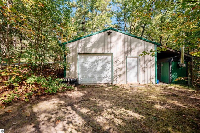 view of outbuilding with a garage