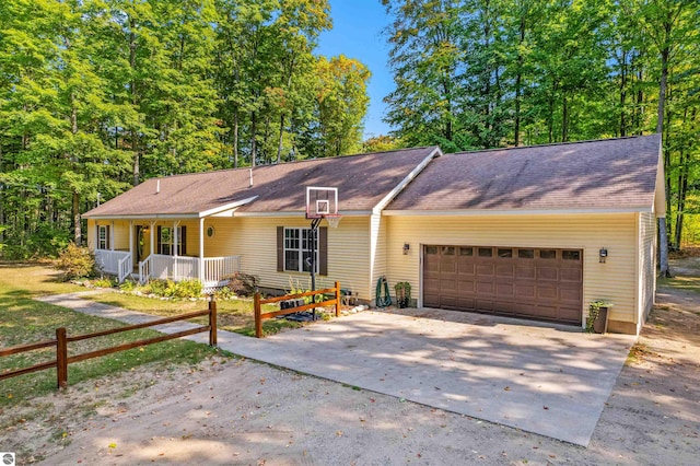 ranch-style house with a porch and a garage