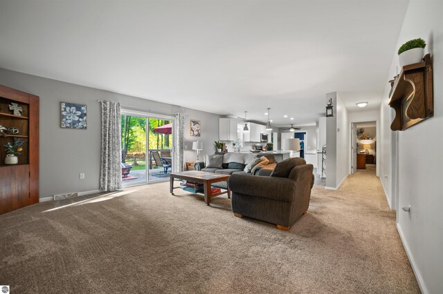 living room featuring light carpet