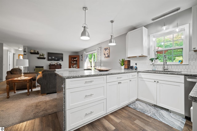 kitchen featuring pendant lighting, white cabinets, plenty of natural light, and sink