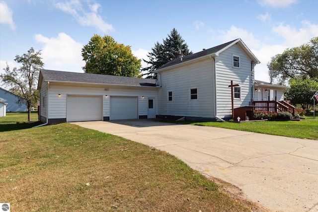 view of front of house with a garage and a front lawn