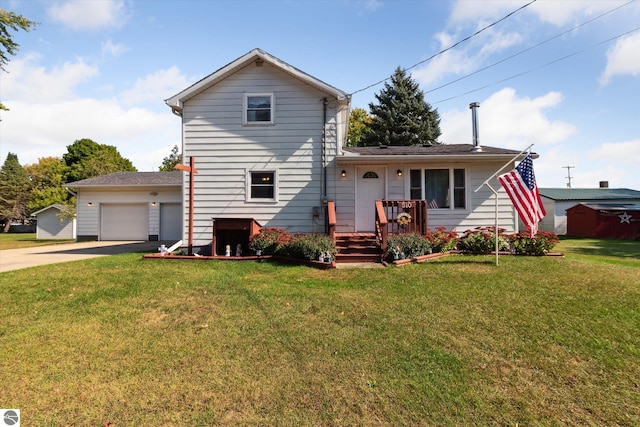 view of property featuring a front lawn and a garage